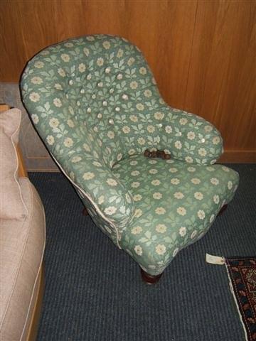 Appraisal: A Victorian button upholstered armchair with turned legs