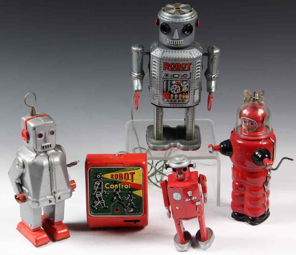 Appraisal: JAPANESE TIN TOY ROBOTS - s- s Tin Litho Robots