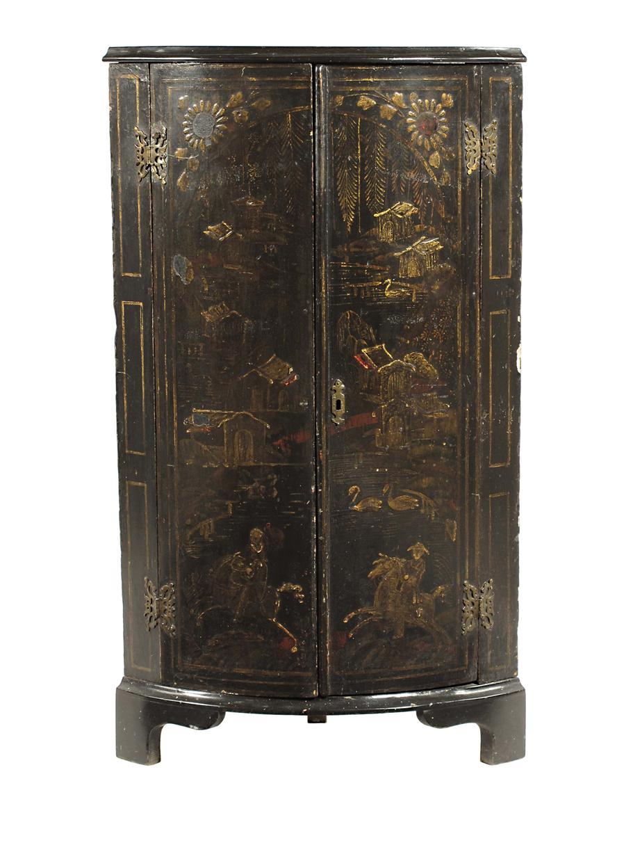 Appraisal: A japanned bowfront standing corner cupboard