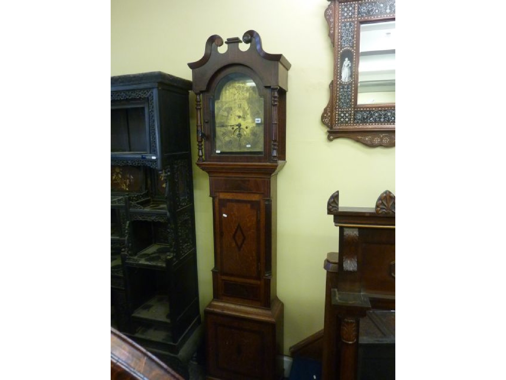 Appraisal: A Regency oak and mahogany longcase clock with turned spindle