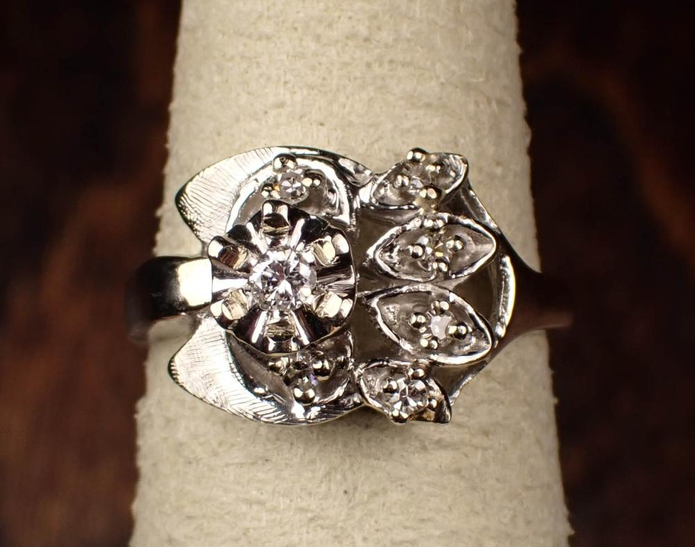 Appraisal: DIAMOND AND FOURTEEN KARAT WHITE GOLD RING with six round