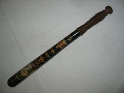 Appraisal: A VICTORIAN EBONISED TRUNCHEON gilded and painted with a castle