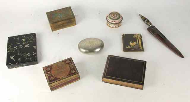 Appraisal: An oval engine turned tobacco box and cover four decorative