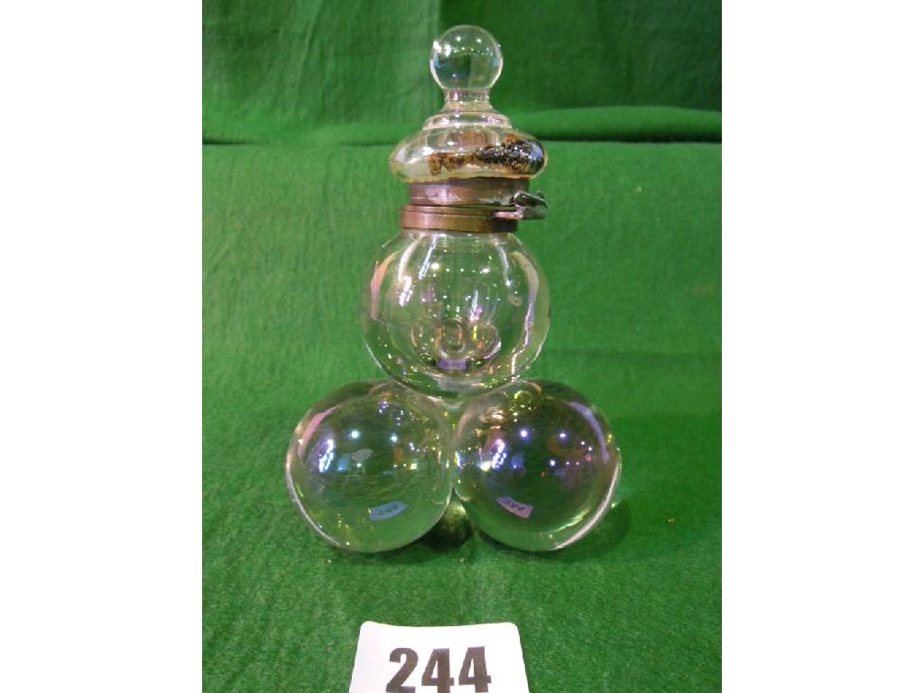 Appraisal: An unusual glass inkwell formed from four glass spheres