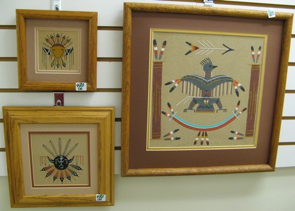 Appraisal: THREE NAVAJO SAND PAINTINGS an eagle in by in a