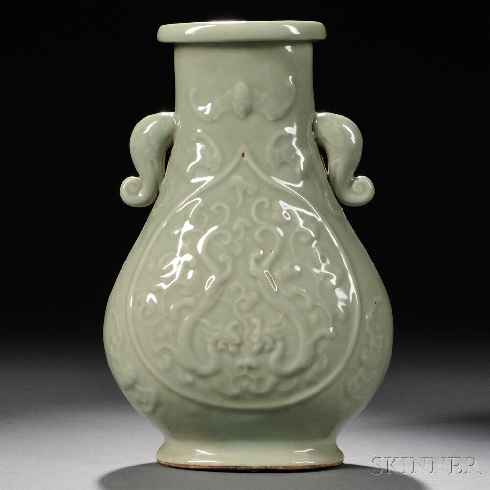 Appraisal: Celadon Vase China hu-form elephant-shaped handles on the neck decorated