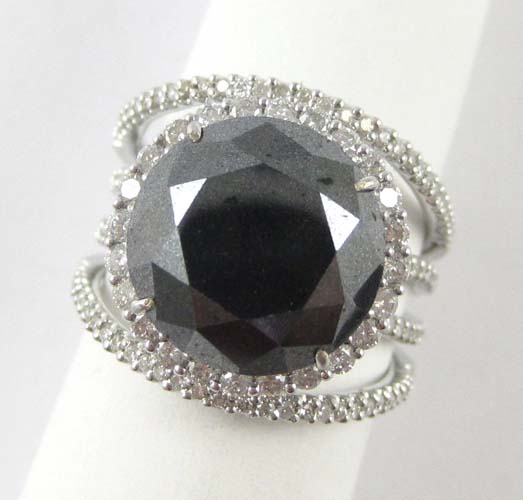 Appraisal: BLACK DIAMOND AND EIGHTEEN KARAT WHITE GOLD RING with round