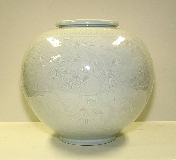 Appraisal: A large white glazed porcelain globular jar Decorated in white