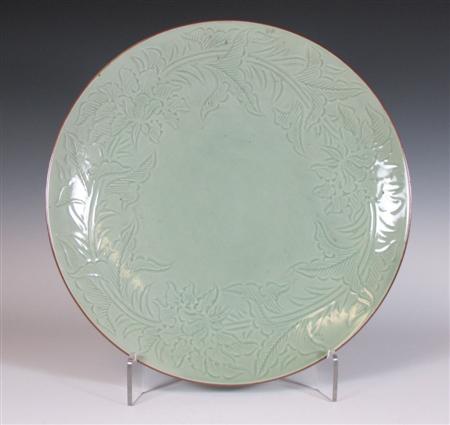 Appraisal: A large Japanese celadon plate Meiji Period with incised floral