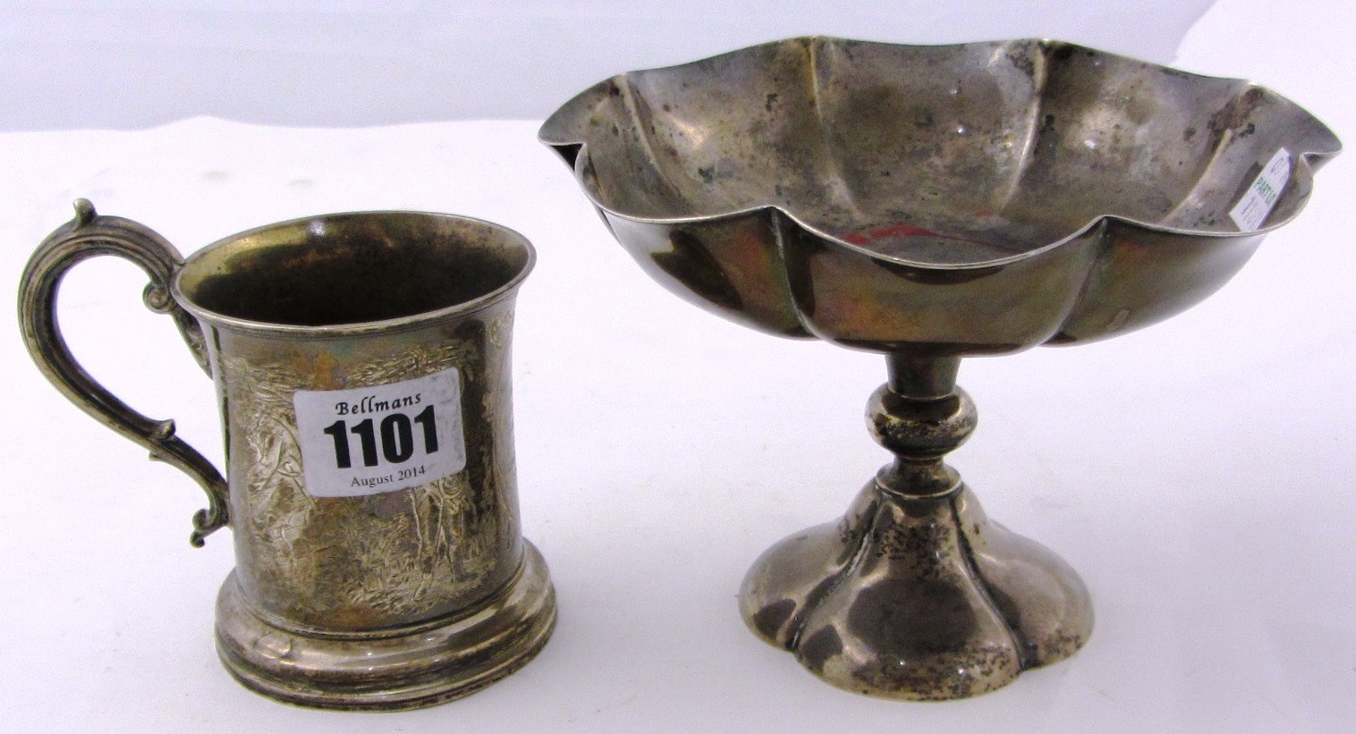 Appraisal: A Victorian silver christening mug engraved with standing figures later