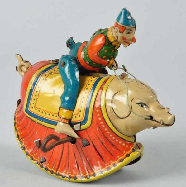 Appraisal: Tin Litho Clown Riding Pig Wind-Up Toy Description German Working