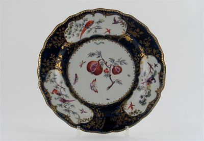 Appraisal: A Chelsea plate the well painted with pomegranates on a