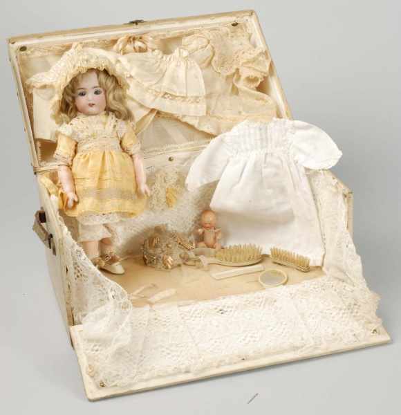 Appraisal: Exceptional German Bisque Child Doll with Trunk Description Bisque socket