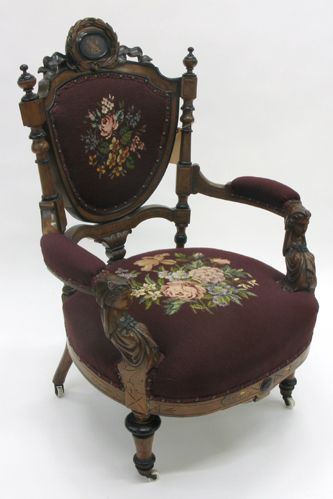 Appraisal: VICTORIAN WALNUT AND FLORAL NEEDLEPOINT ARMCHAIR attributed to John Jeliff