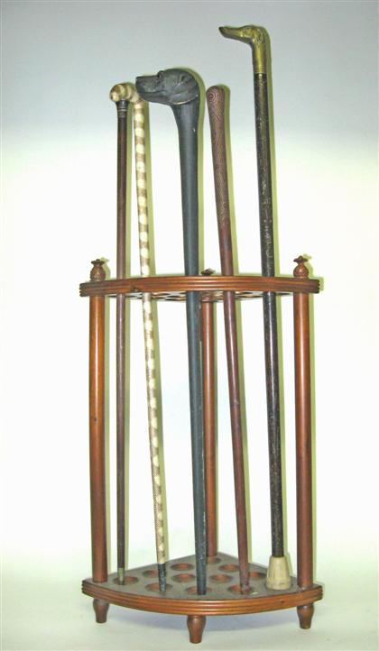 Appraisal: Mahogany stand with five assorted canes stand H in cane