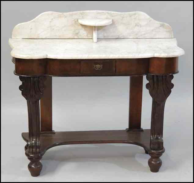 Appraisal: CARVED MAHOGANY WASHSTAND With a marble top H '' W