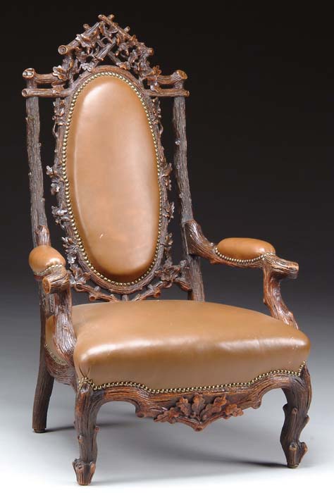 Appraisal: RARE WALNUT BLACK FOREST CARVED ARMCHAIR Open armchair having brown