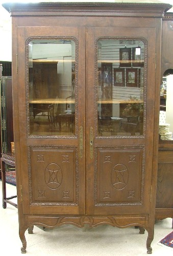 Appraisal: LOUIS XV STYLE OAK CABINET BOOKCASE French c having a