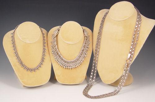 Appraisal: PERSIAN STERLING SILVER CHAINS Intricate interlocking large loop links ''