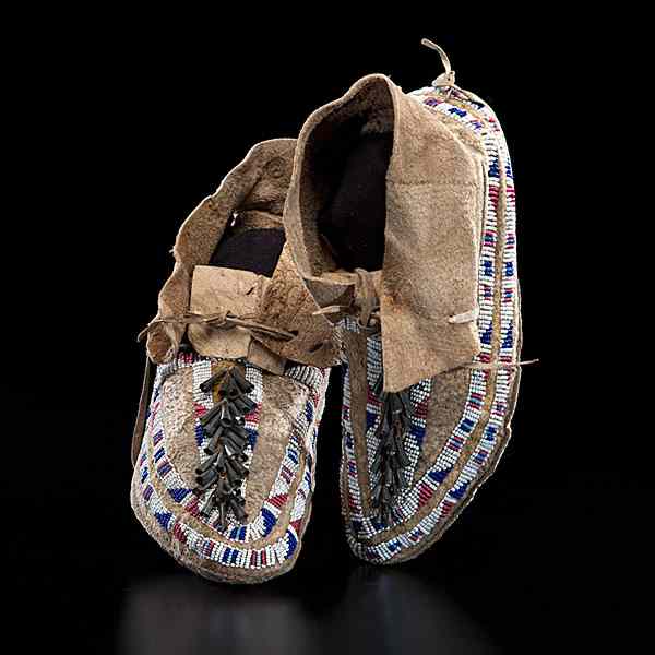 Appraisal: Sioux Beaded Hide Moccasins sinew-sewn and beaded using colors of