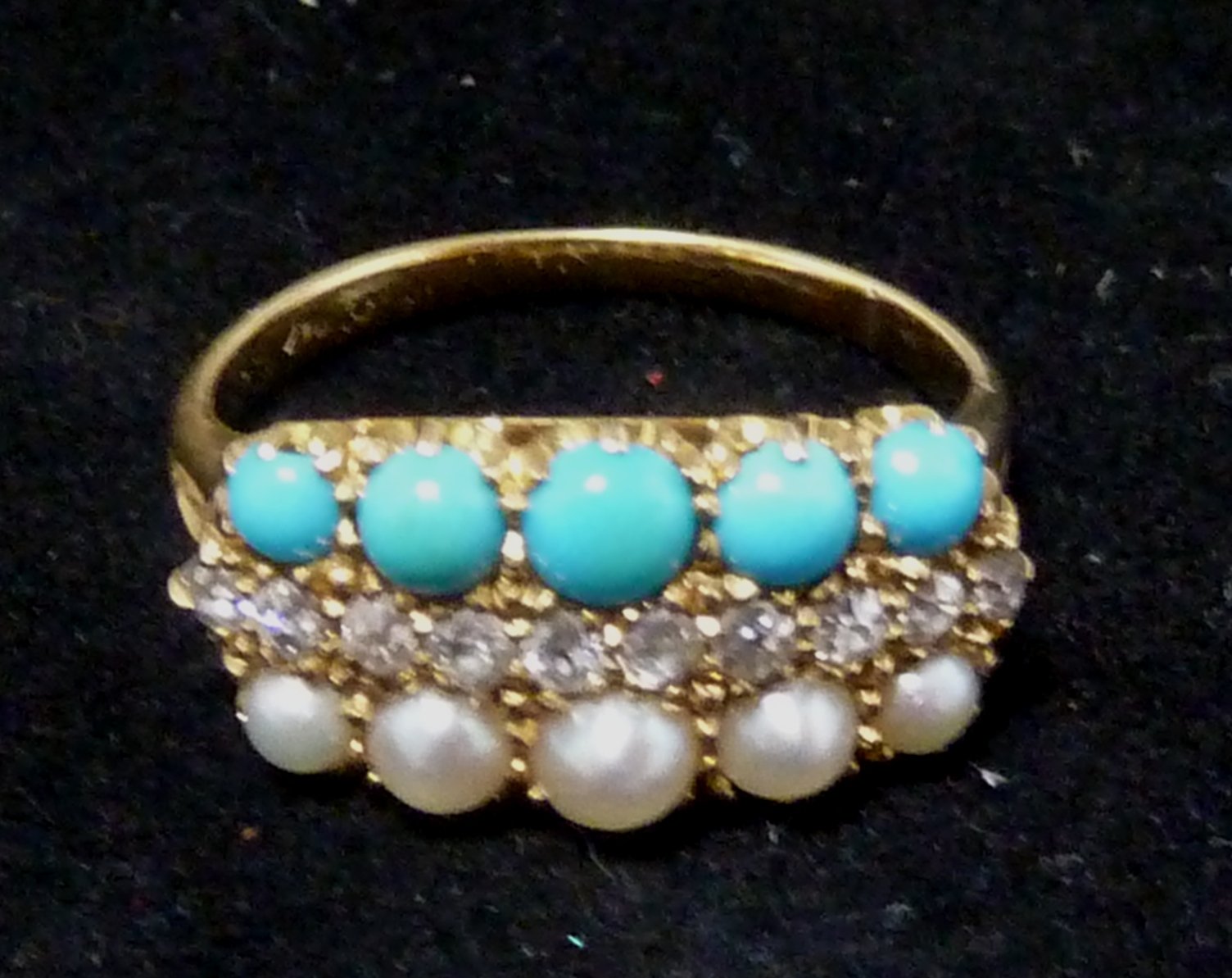 Appraisal: A turquoise diamond and pearl three-row ring in a claw