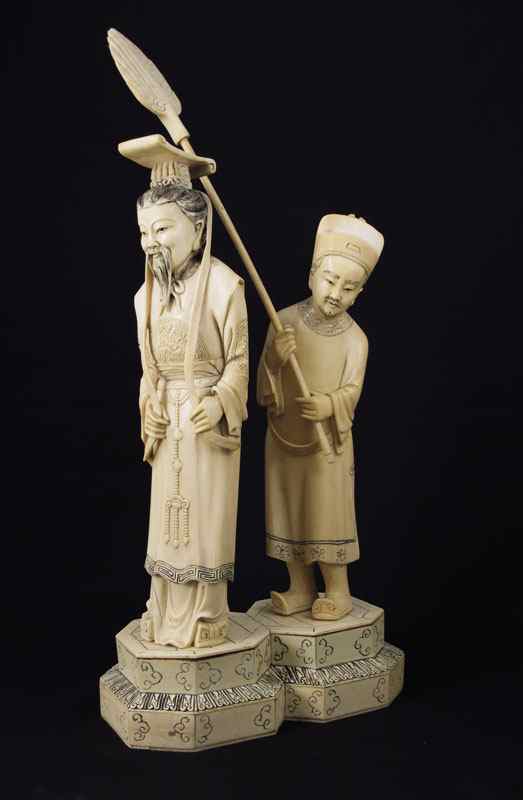 Appraisal: CARVED IVORY ROYAL GENTLEMAN WITH ATTENDANT Large carving of a