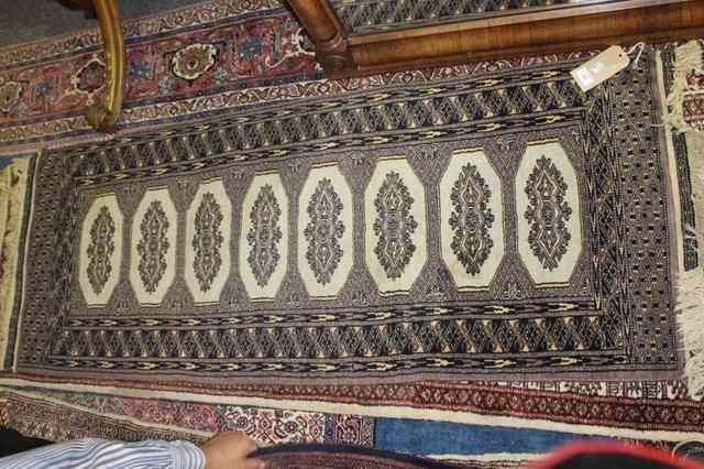 Appraisal: A PAKISTAN WOOL RUG with central medallions x and a