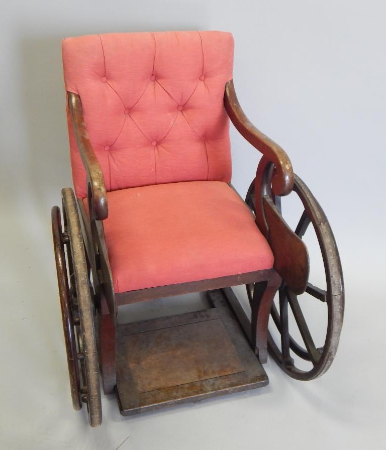 Appraisal: A Victorian mahogany bath chair with a padded back and