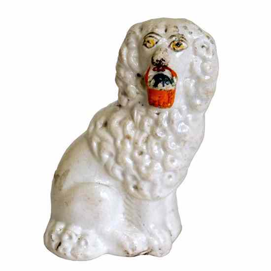 Appraisal: An English Victorian Staffordshire Pottery Poodle Dog circa the white