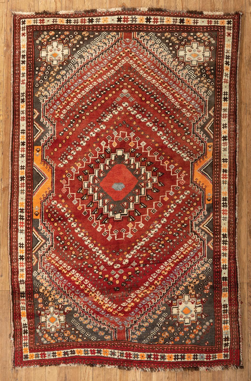 Appraisal: Persian Qashqai Carpet red ground repeating chevron design ft in