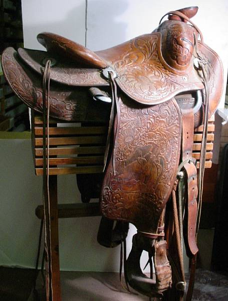 Appraisal: A prison-made tooled leather western saddle owned by Santa Fe