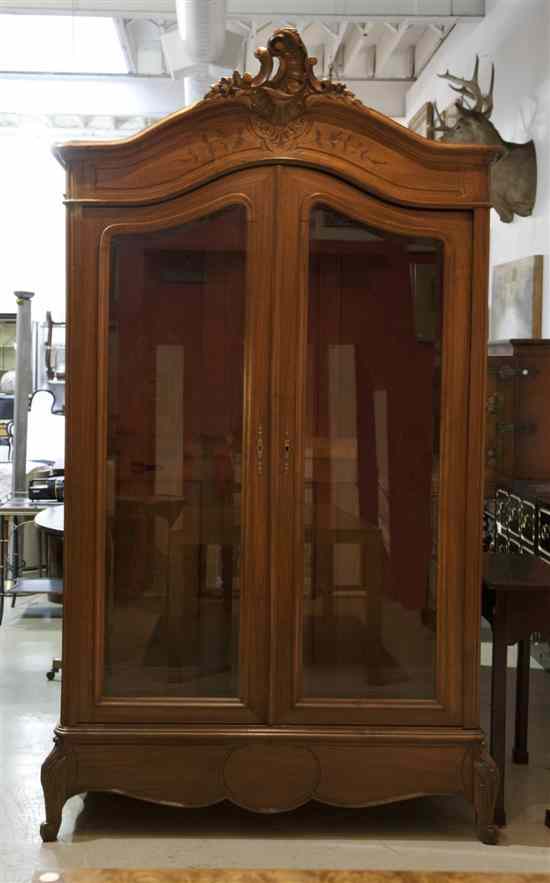 Appraisal: A Louis XV Style Mahogany Armoire having an arched foliate