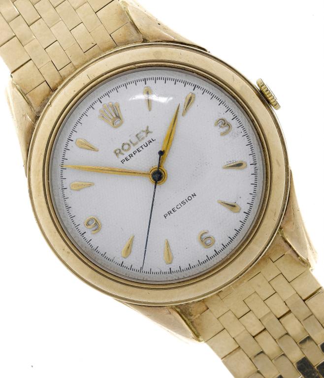 Appraisal: A ROLEX GOLD GENTLEMAN'S WRISTWATCH the dial with arabic and