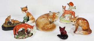 Appraisal: lot of One shelf of porcelain and pottery fox figurines