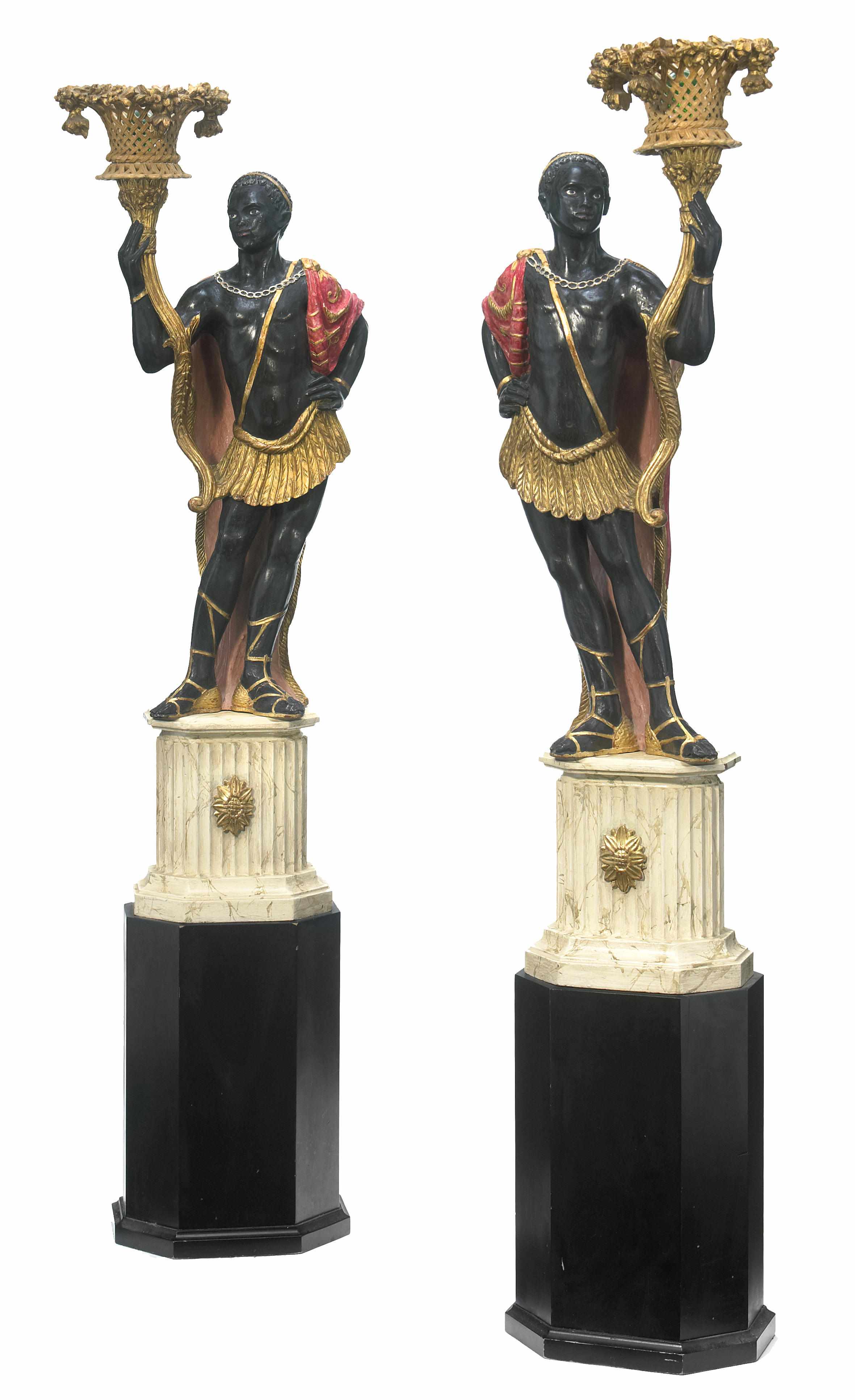 Appraisal: A pair of Venetian style carved giltwood and ebonized blackamoors