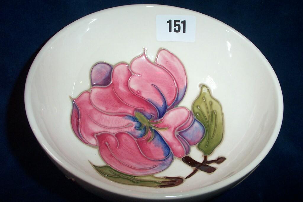 Appraisal: A cream ground Moorcroft bowl of circular form with moulded