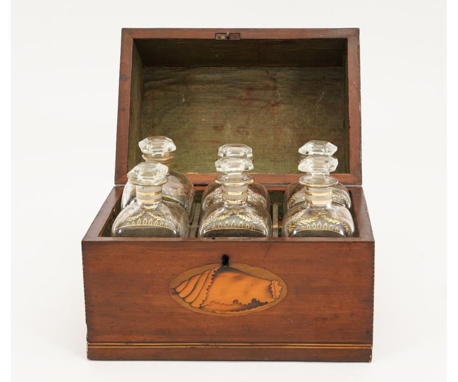 Appraisal: Georgian mahogany conch shell inlaid bottle box fitted with six