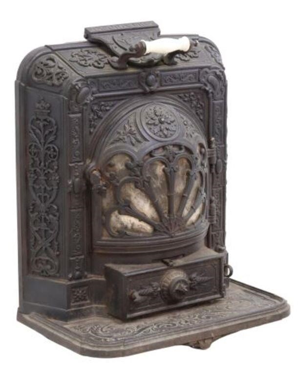 Appraisal: French La Chimere cast iron wood-burning stove Henri Faure Revin