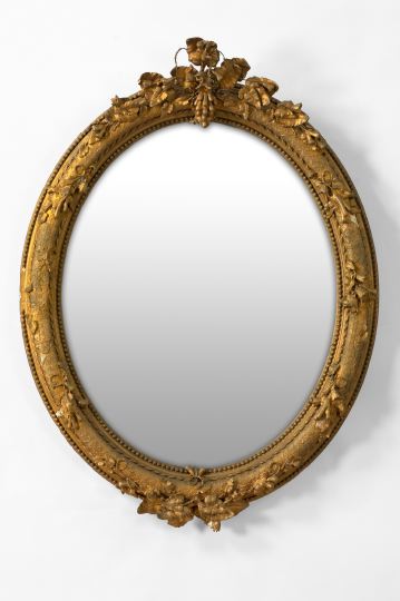 Appraisal: Louis XV-Style Giltwood Looking Glass late th century the oval