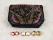 Appraisal: An evening bag with bead decoration together with three pairs