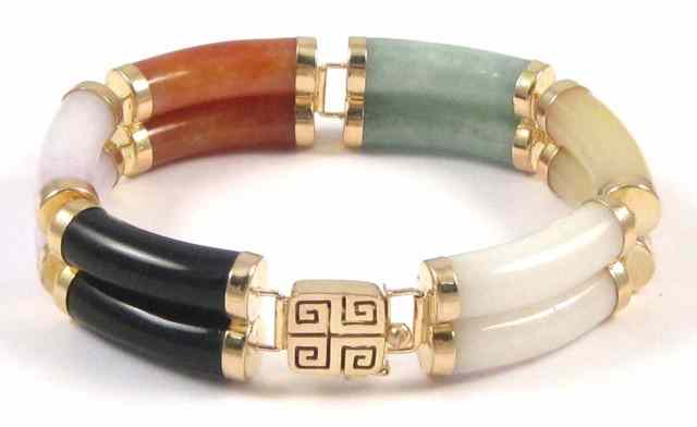 Appraisal: MULTI-COLORED JADE BRACELET green orange yellow white and black jade