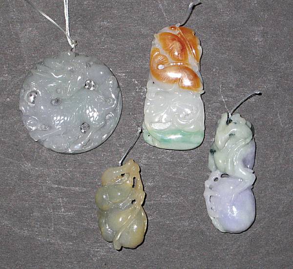 Appraisal: A group of four jadeite pendants The first of circular