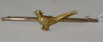 Appraisal: A CT GOLD BAR BROOCH centred by a pheasant cased