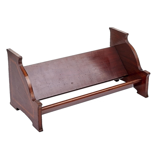 Appraisal: An Edwardian mahogany book trough crossbanded in satinwood and line