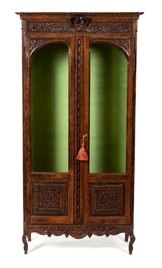 Appraisal: A French Provincial Style Carved Oak Display Cabinet Height x