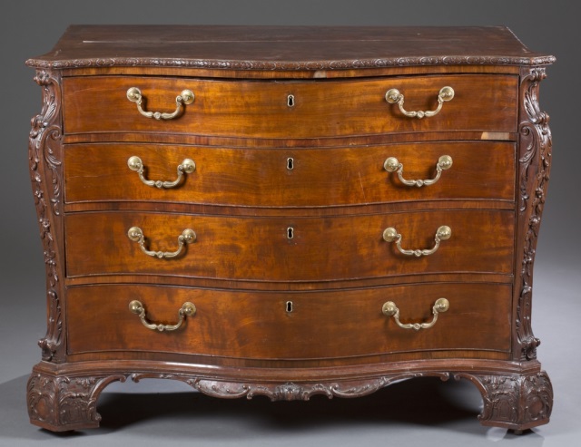 Appraisal: Mahogany with oak secondary Serpentine top with foliate-carved edge berried