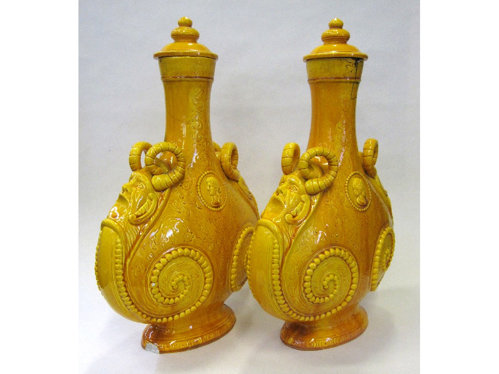 Appraisal: Pair of Victorian yellow glazed earthenware pilgrim flasks and covers