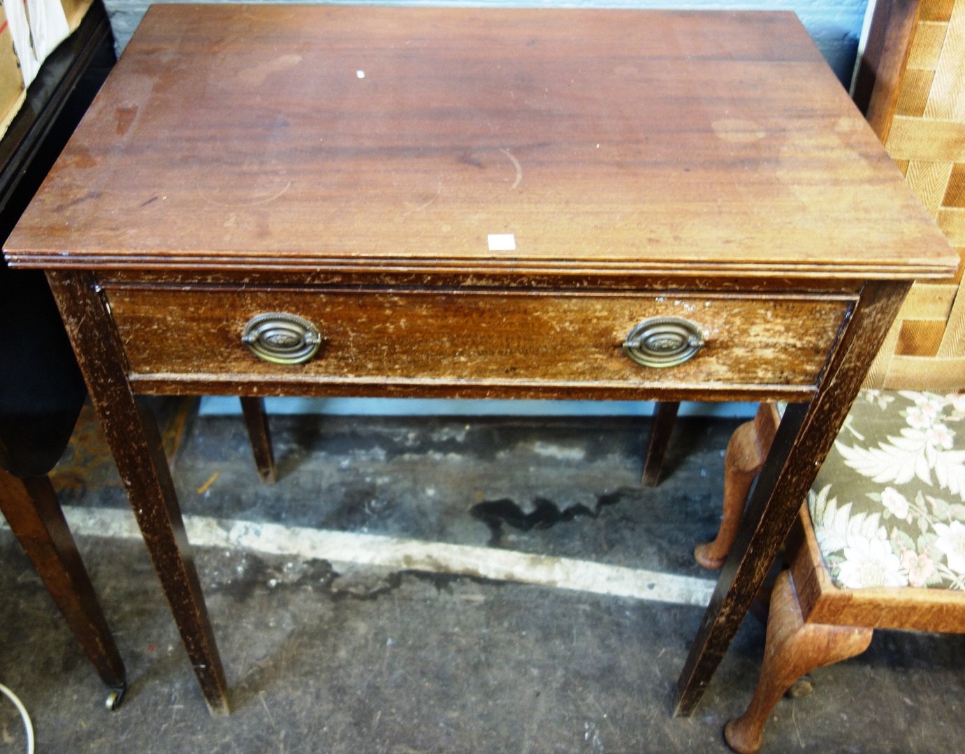 Appraisal: A George III mahogany Pembroke table on square tapered legs