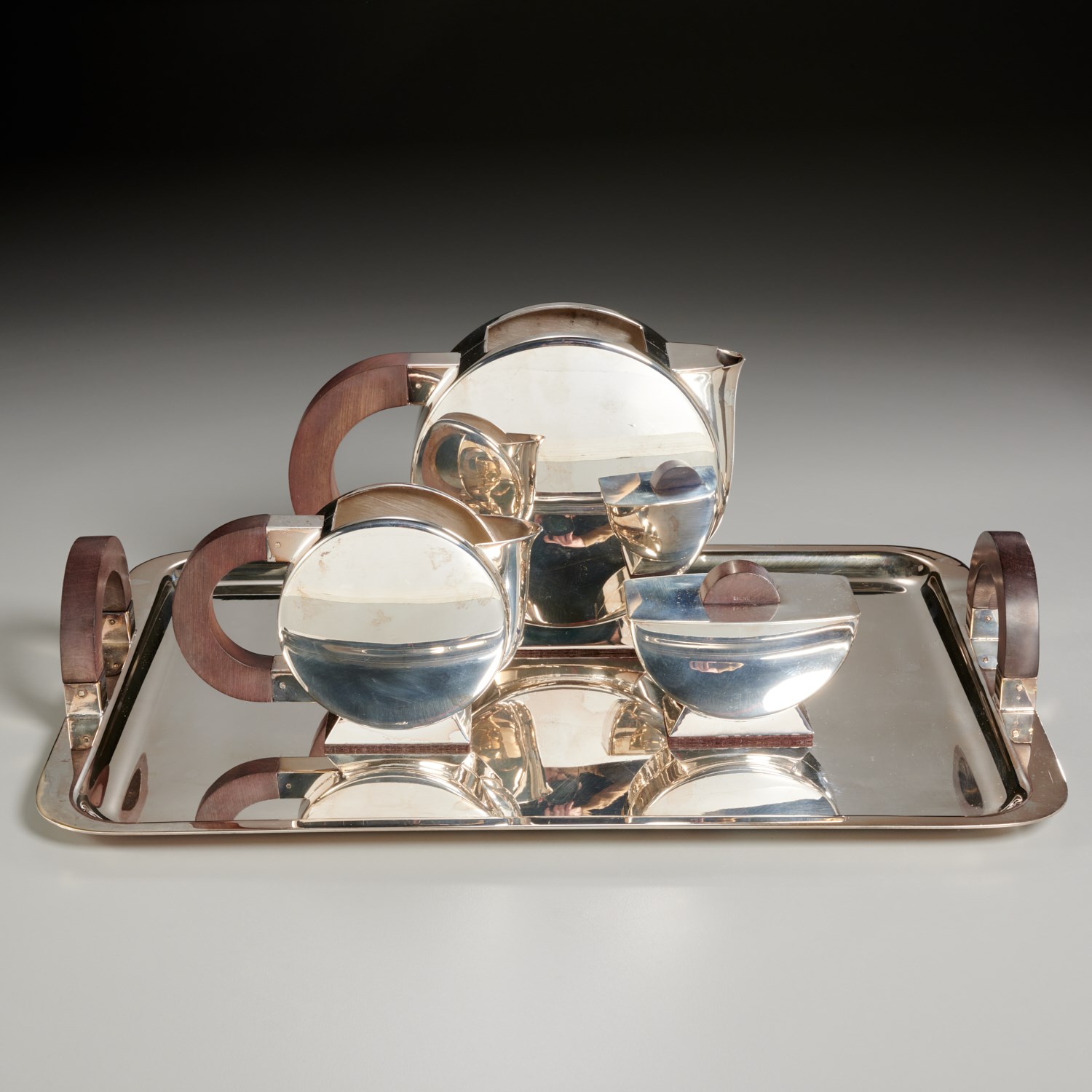 Appraisal: CHRISTOFLE EBONY-MOUNTED SILVER PLATE TEA SET designed by Christian Fjerdingstad