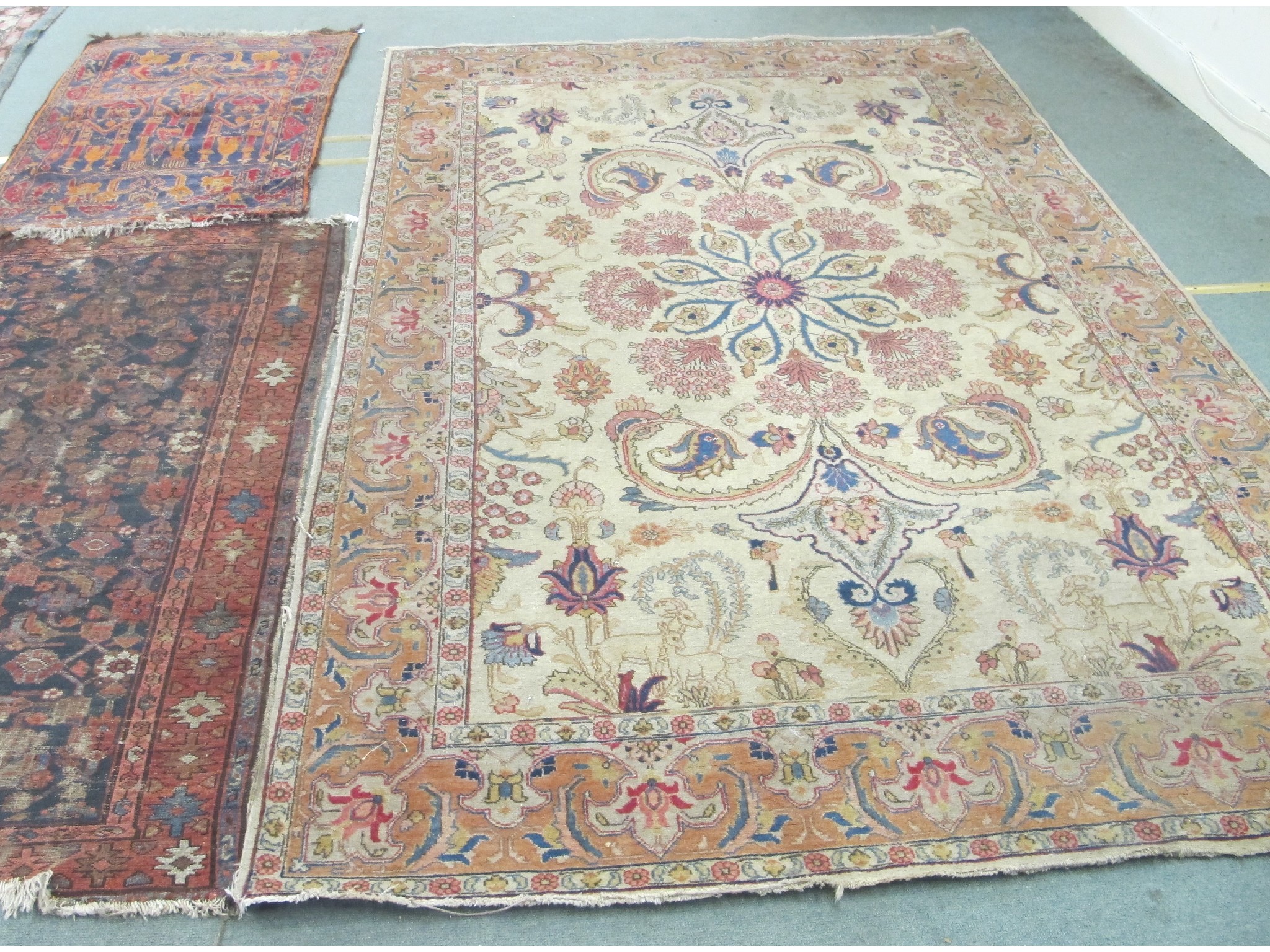 Appraisal: Persian style carpet on a cream ground with two small